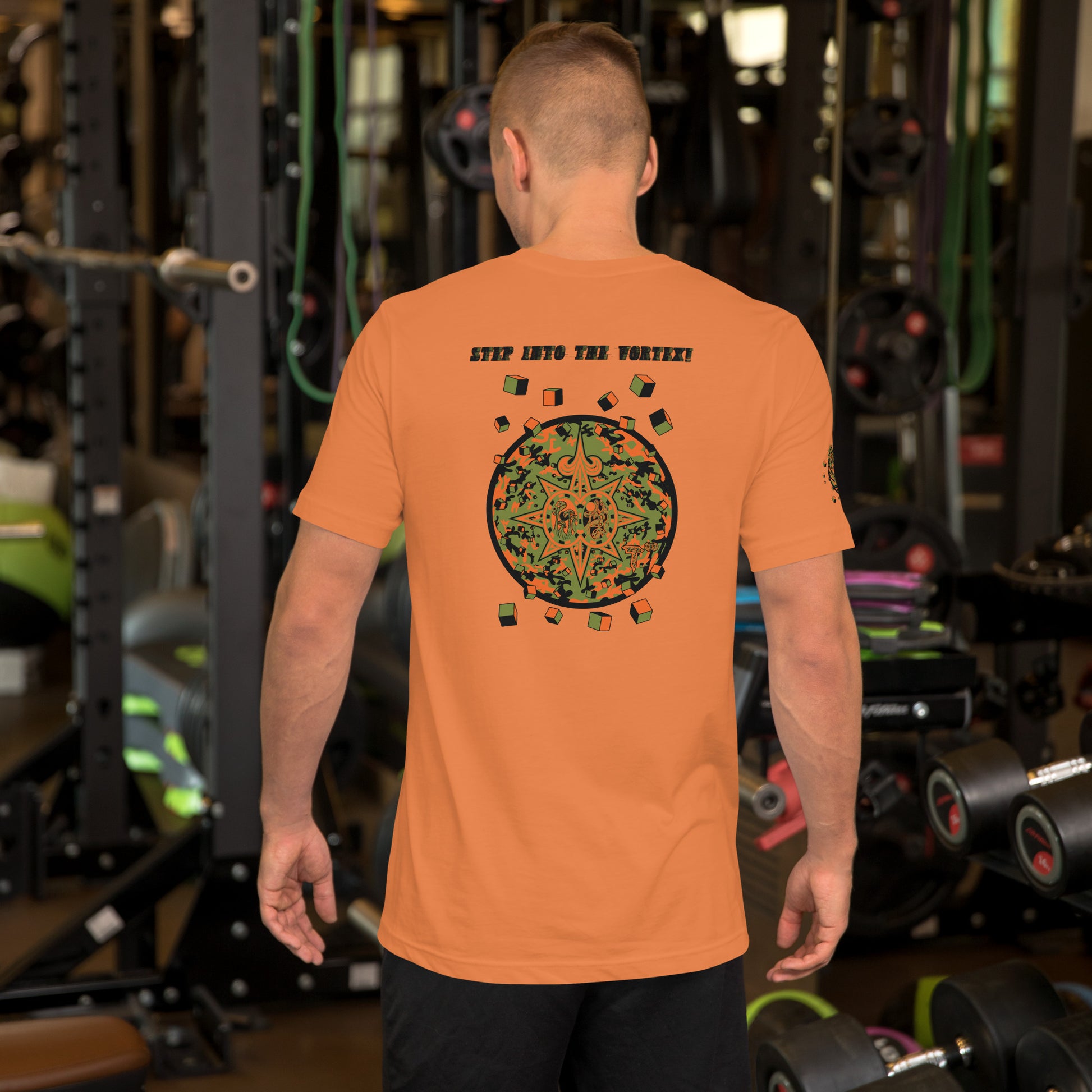 Back view of unisex t-shirt Shroomverse Compass in vibrant orange, showcasing unique graphic design in a gym setting.