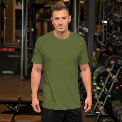 Unisex t-shirt Shroomverse Compass in olive green modeled in a gym setting for fitness enthusiasts.